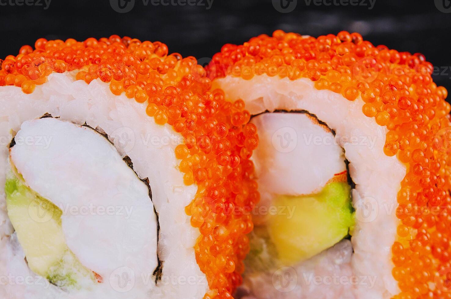 Sushi roll with shrimp, avocado cheese and tobiko caviar photo