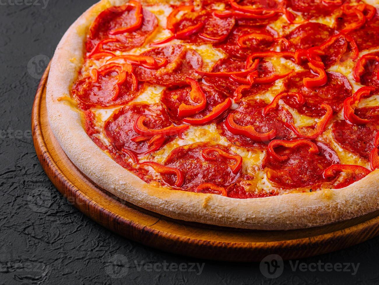 tasty pepperoni pizza with red bell peper photo