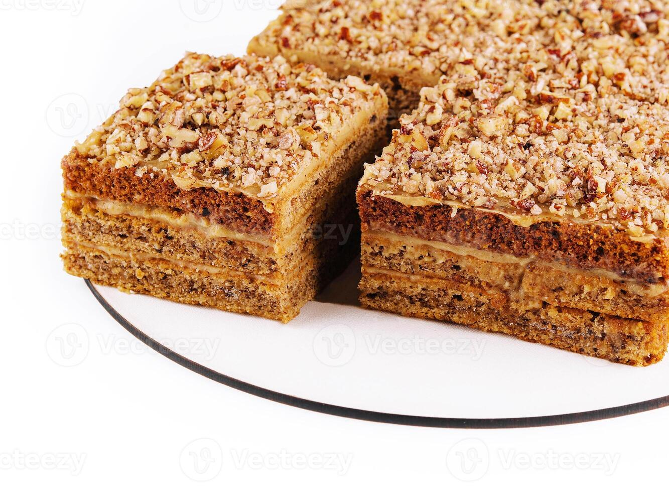 Carrot cake with walnuts on white plate photo