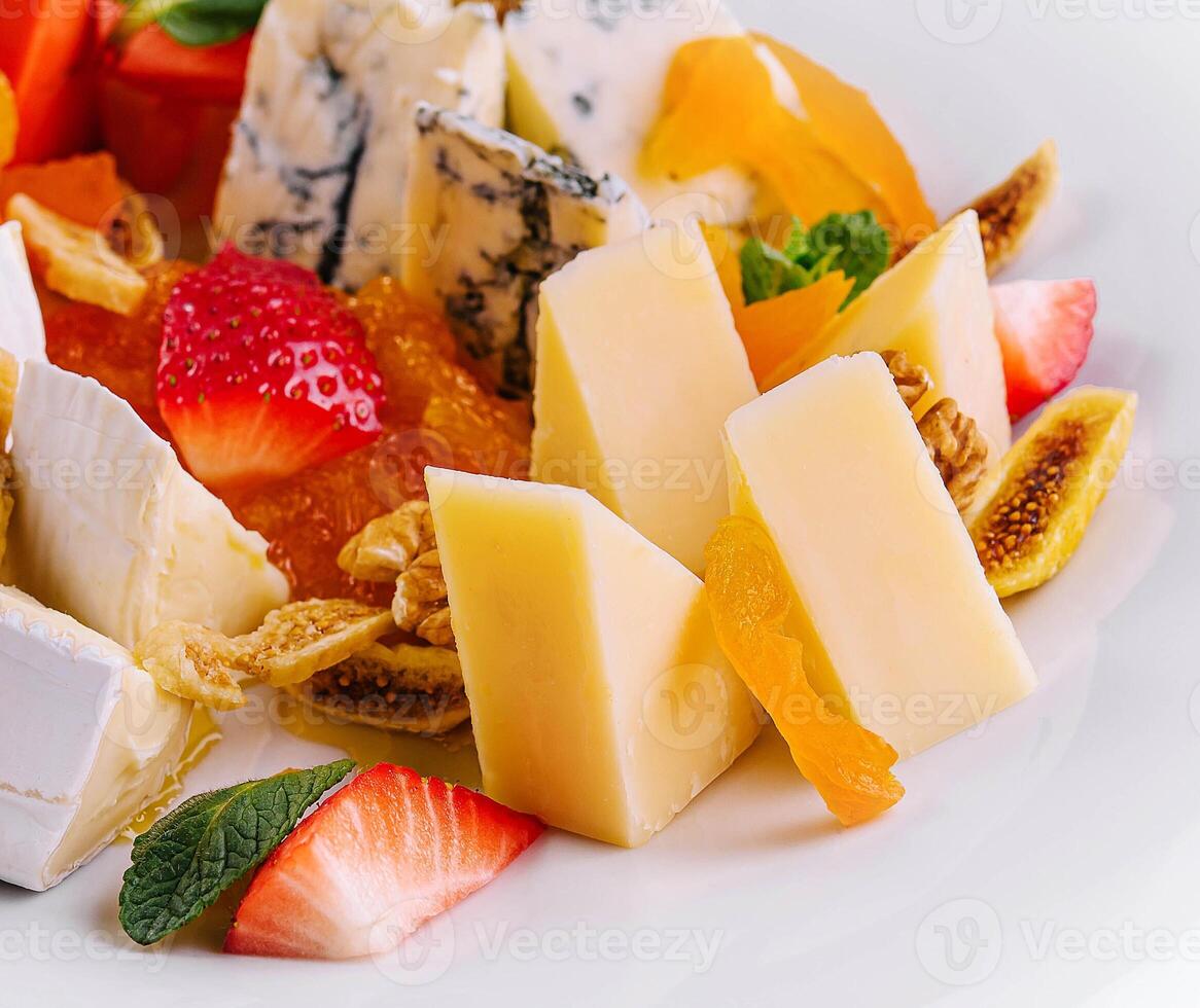 Cheese plate with different types of cheese photo