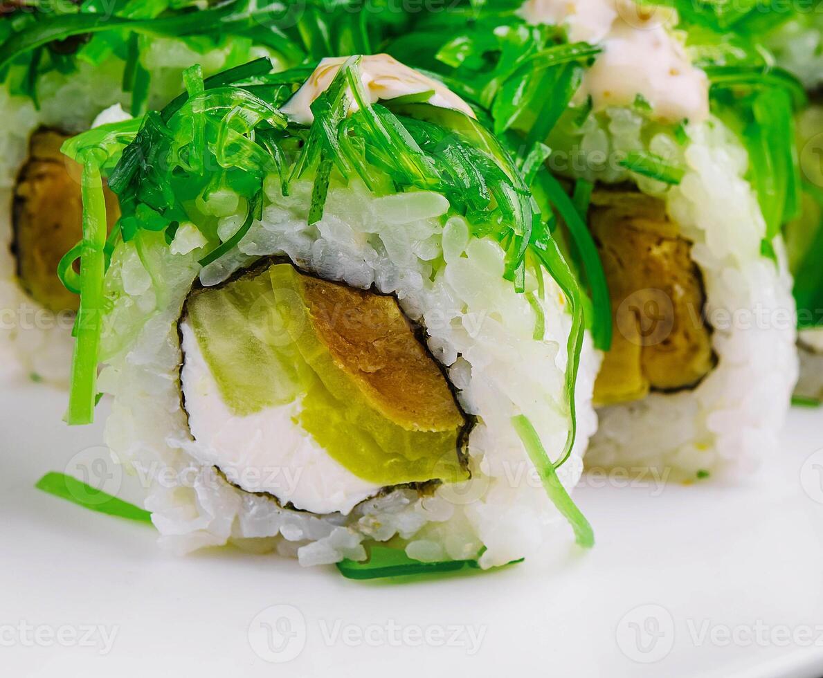 Sushi rolls with seaweed, cheese, and tuna photo