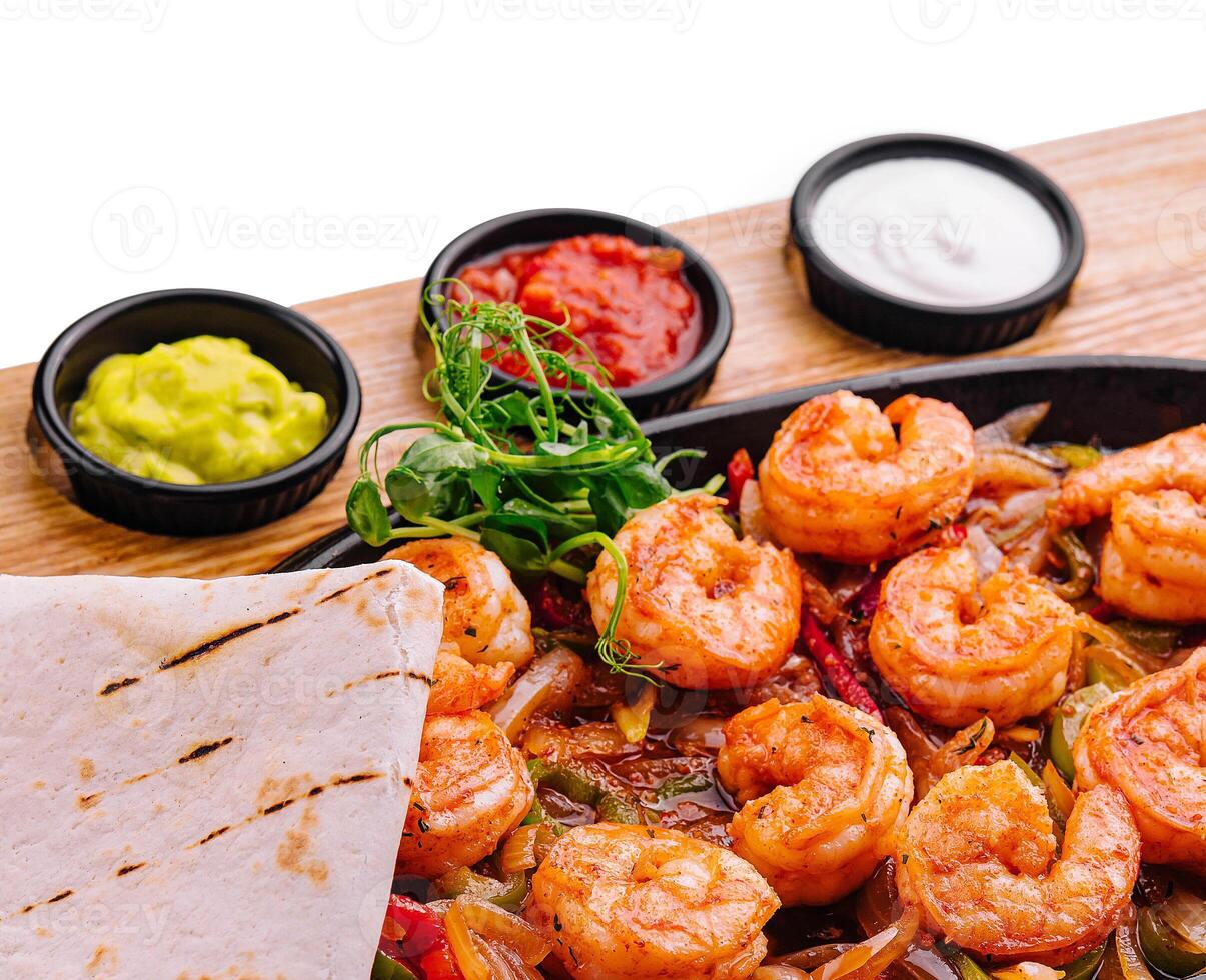 Shrimp fajitas with bell pepper and onion photo