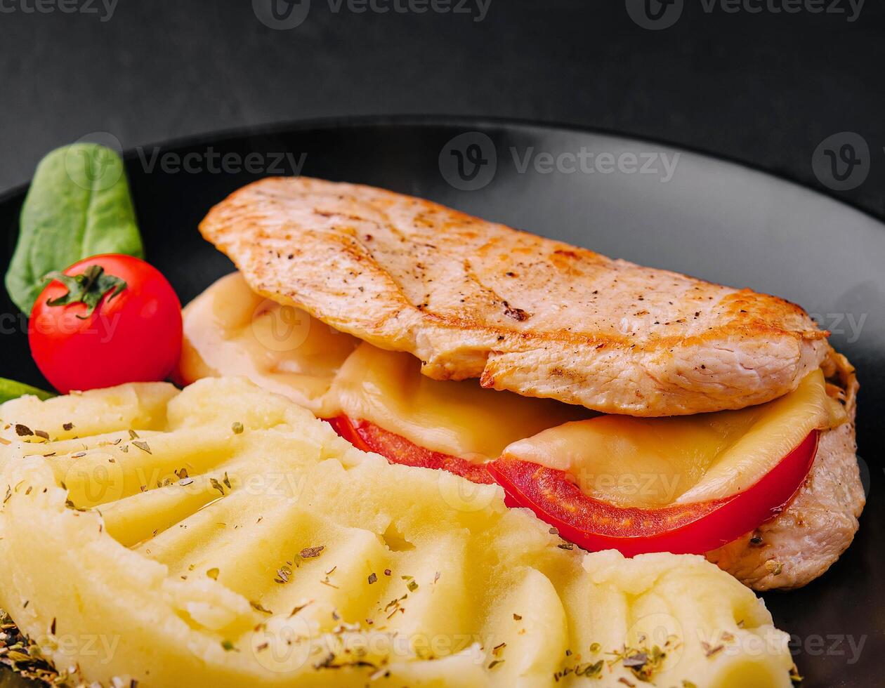 Baked chicken fillet with cheese and mashed potatoes photo