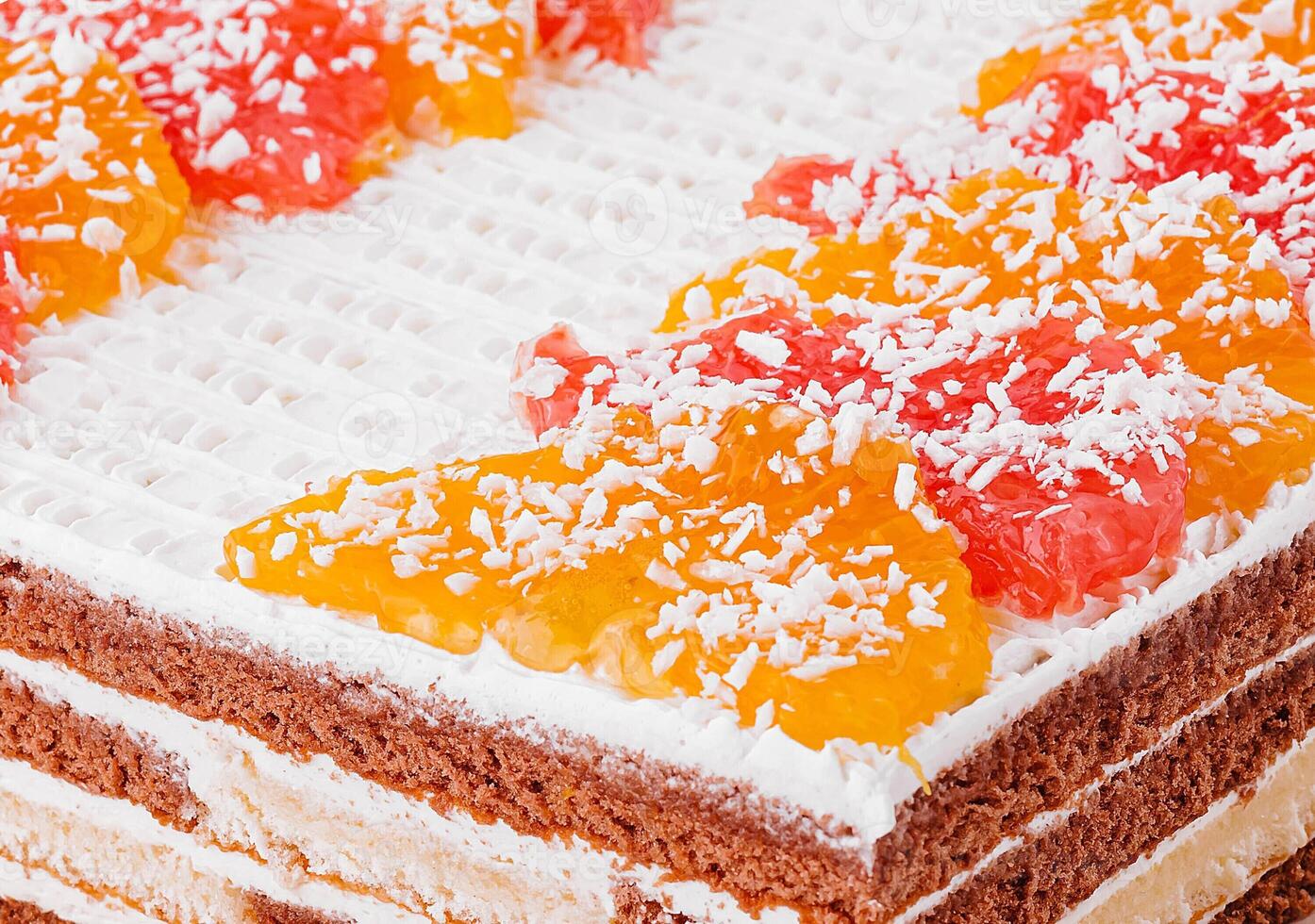 layered chocolate cake with oranges and grapefruits photo