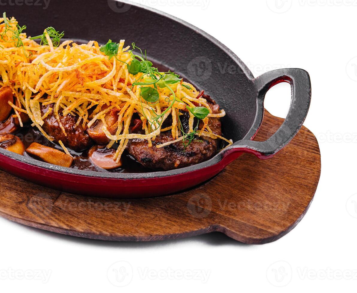 steak with mushrooms and onion chips photo