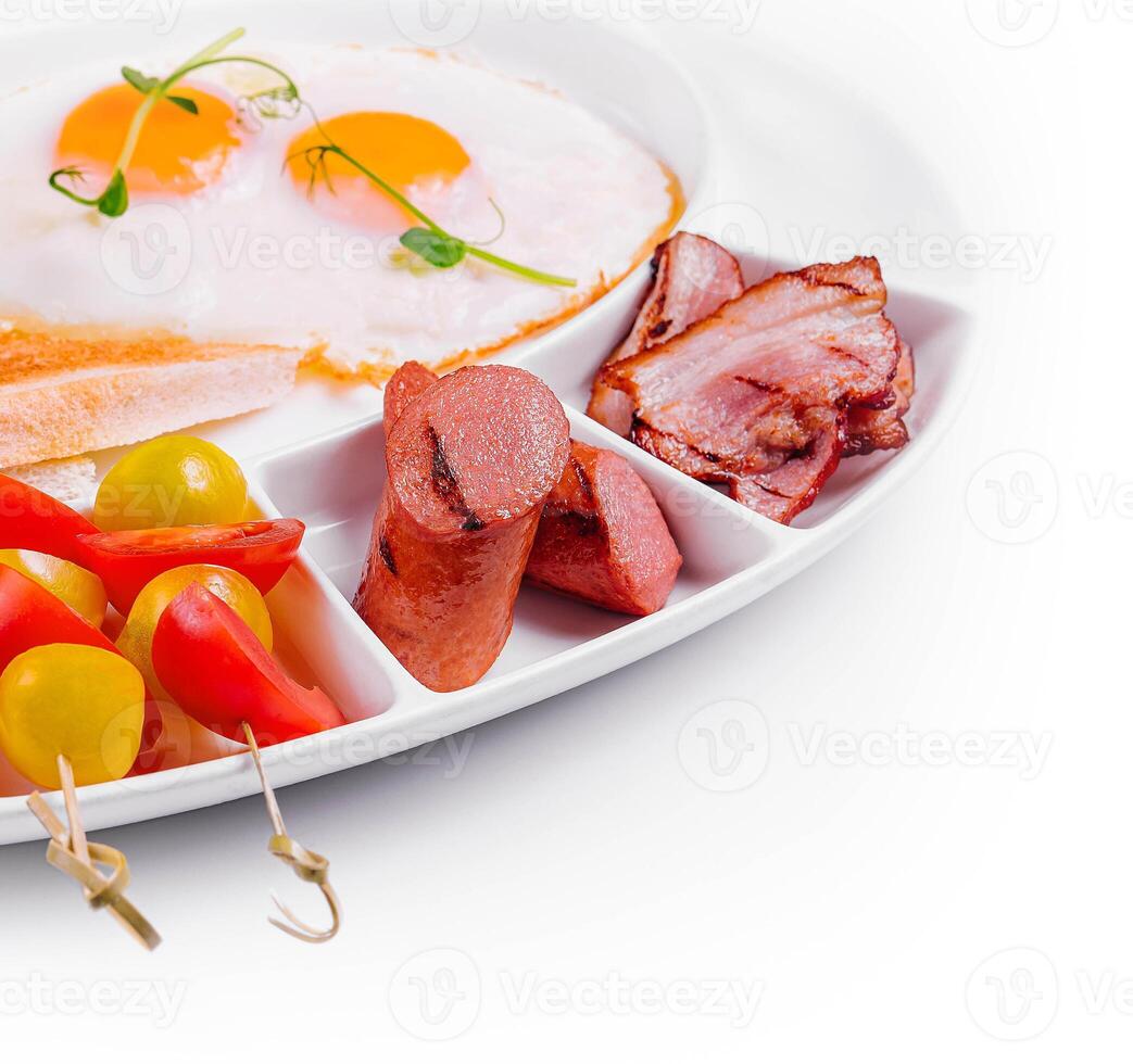 Traditional English breakfast with fried eggs photo
