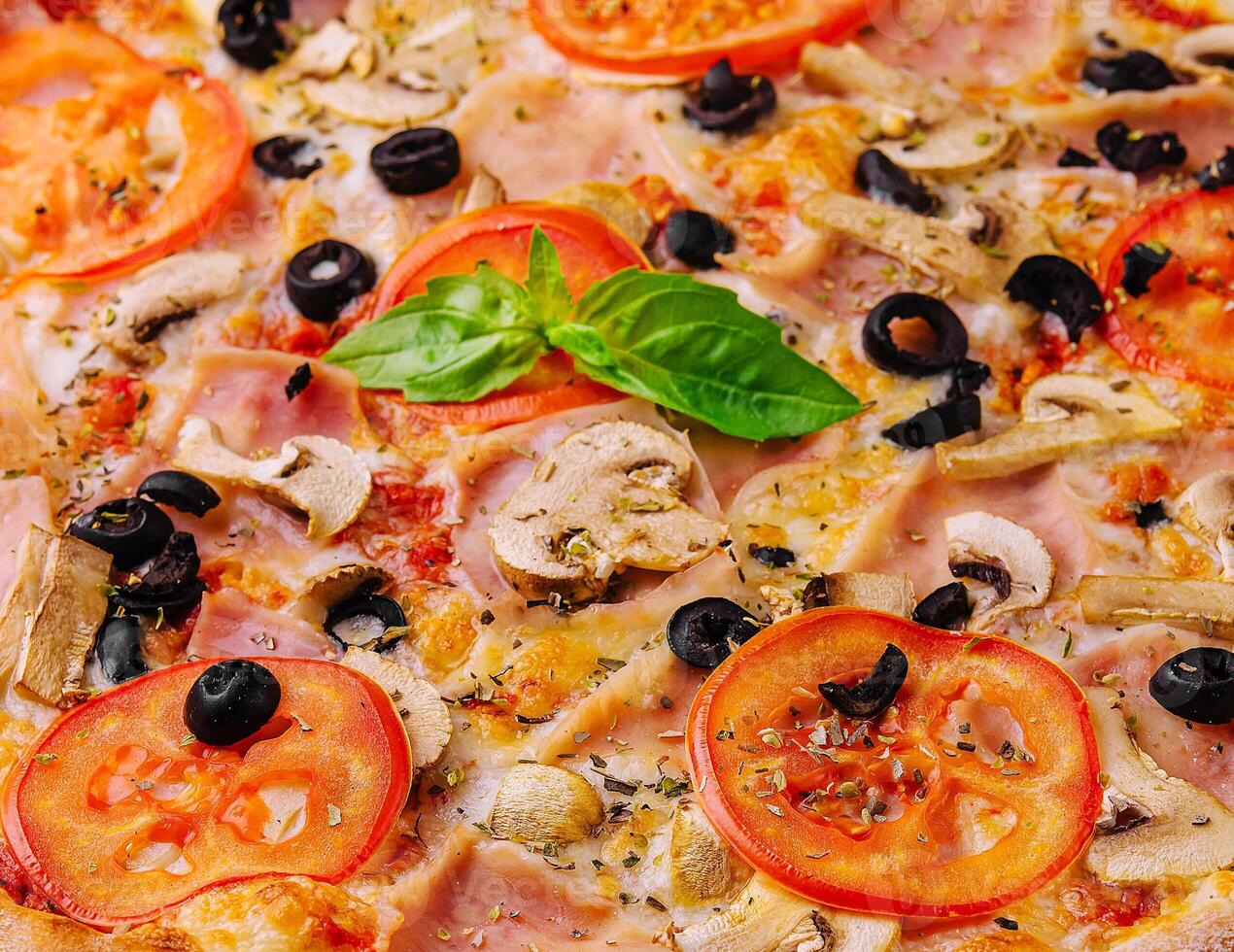 pizza with ham and mushrooms close up photo