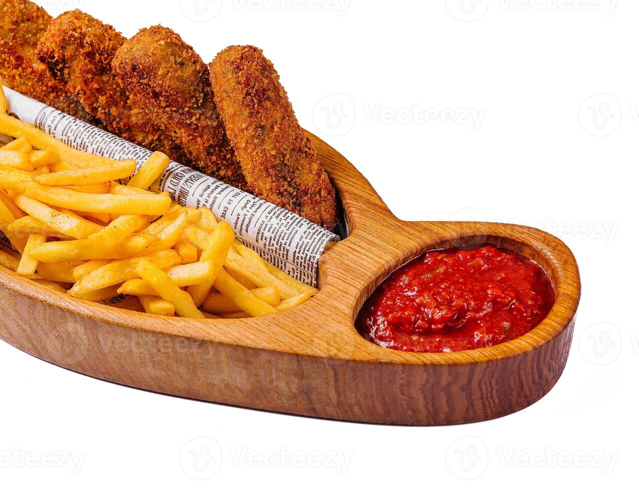 breaded nuggets with a bbq dip and French fries photo