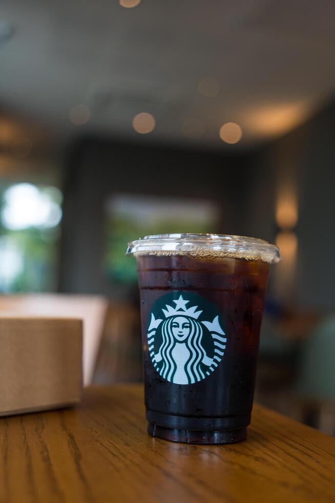 Bangkok, Thailand - March 9, 2024 Starbuck coffee iced americano coffee beverage photo