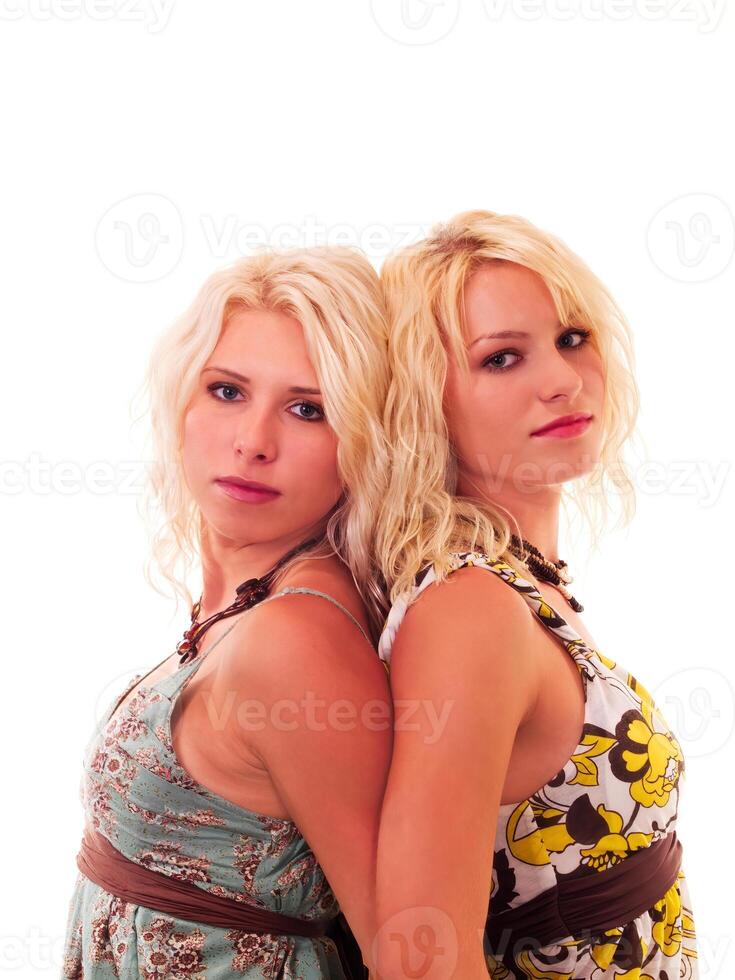 Two Blond Caucasian Sisters Back To Back On White photo