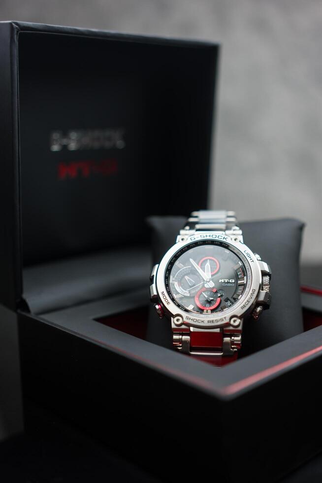 BANGKOK, THAILAND - February 29, 2024 Hand holdog a box of G-Shock model MTG-B1000D-1ADR photo