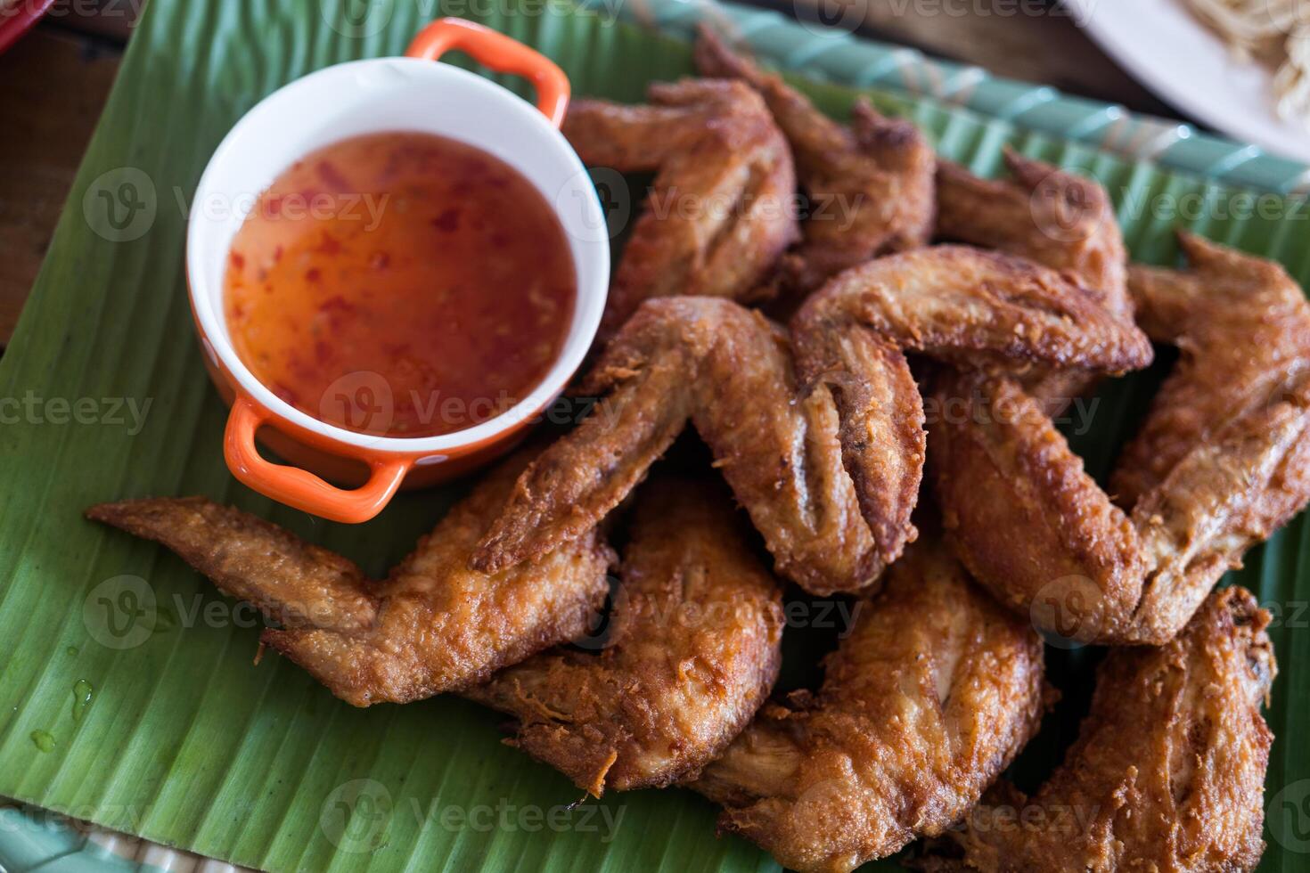 Fried chicken wings with sweet sauce photo