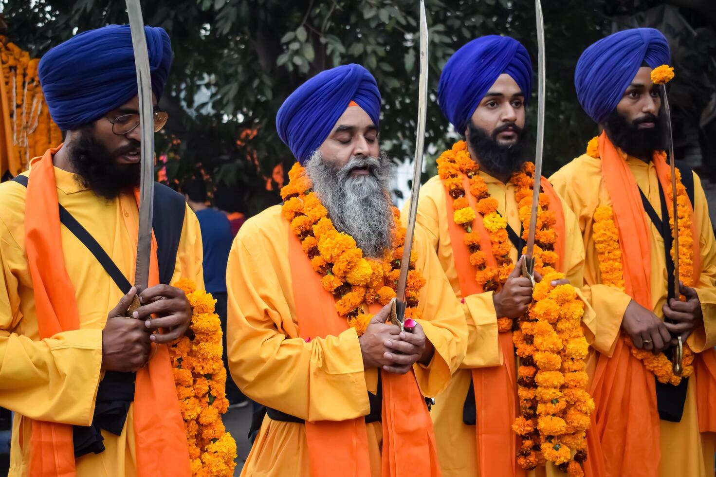 Delhi, India, October 2, 2023 - Sikhs display gatka and martial arts during annual Nagar Kirtan, Traditional, procession on account of birthday of Guru Nanak Dev ji, Nagar Kirtan in East Delhi area photo