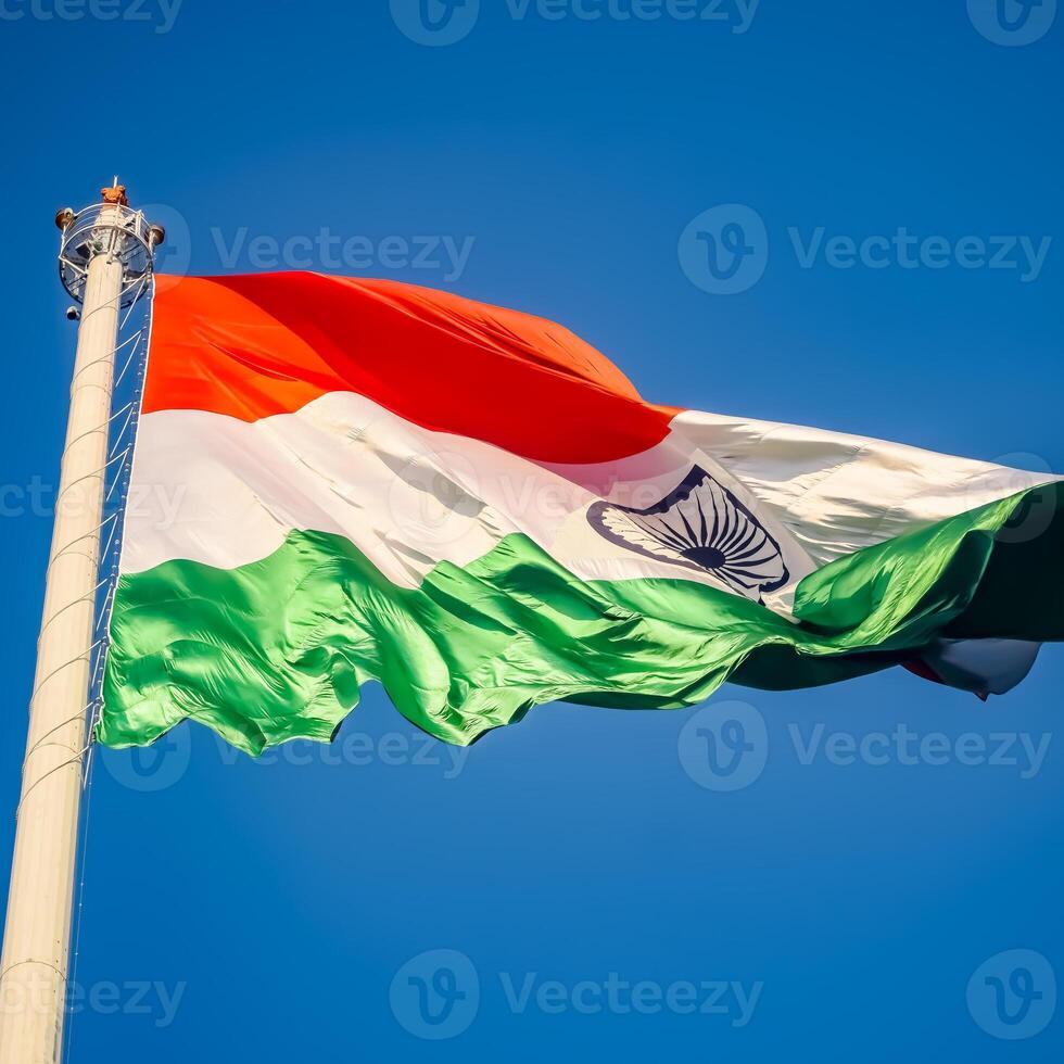 India flag flying high at Connaught Place with pride in blue sky, India flag fluttering, Indian Flag on Independence Day and Republic Day of India, tilt up shot, Waving Indian flag, Har Ghar Tiranga photo