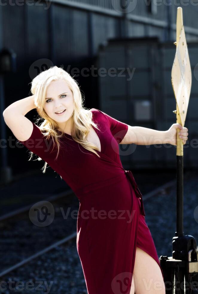 Blond Caucasian Woman Outdoor In Red Dress photo