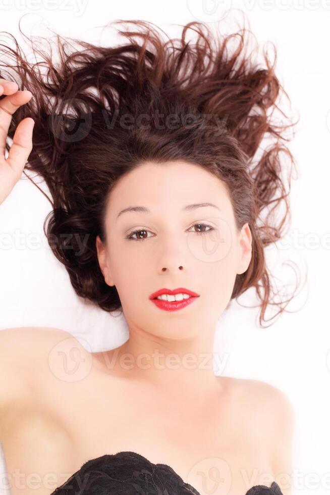 Caucasian woman reclining bare shoulders dark hair photo