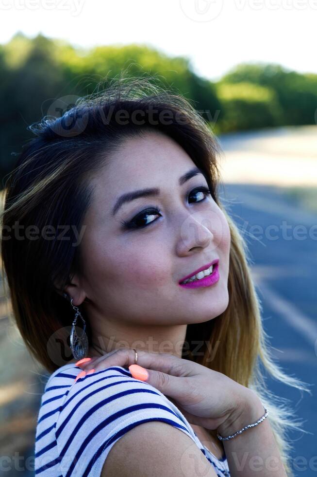 Outdoor Portrait Asian American Woman Hand On Shoulder photo