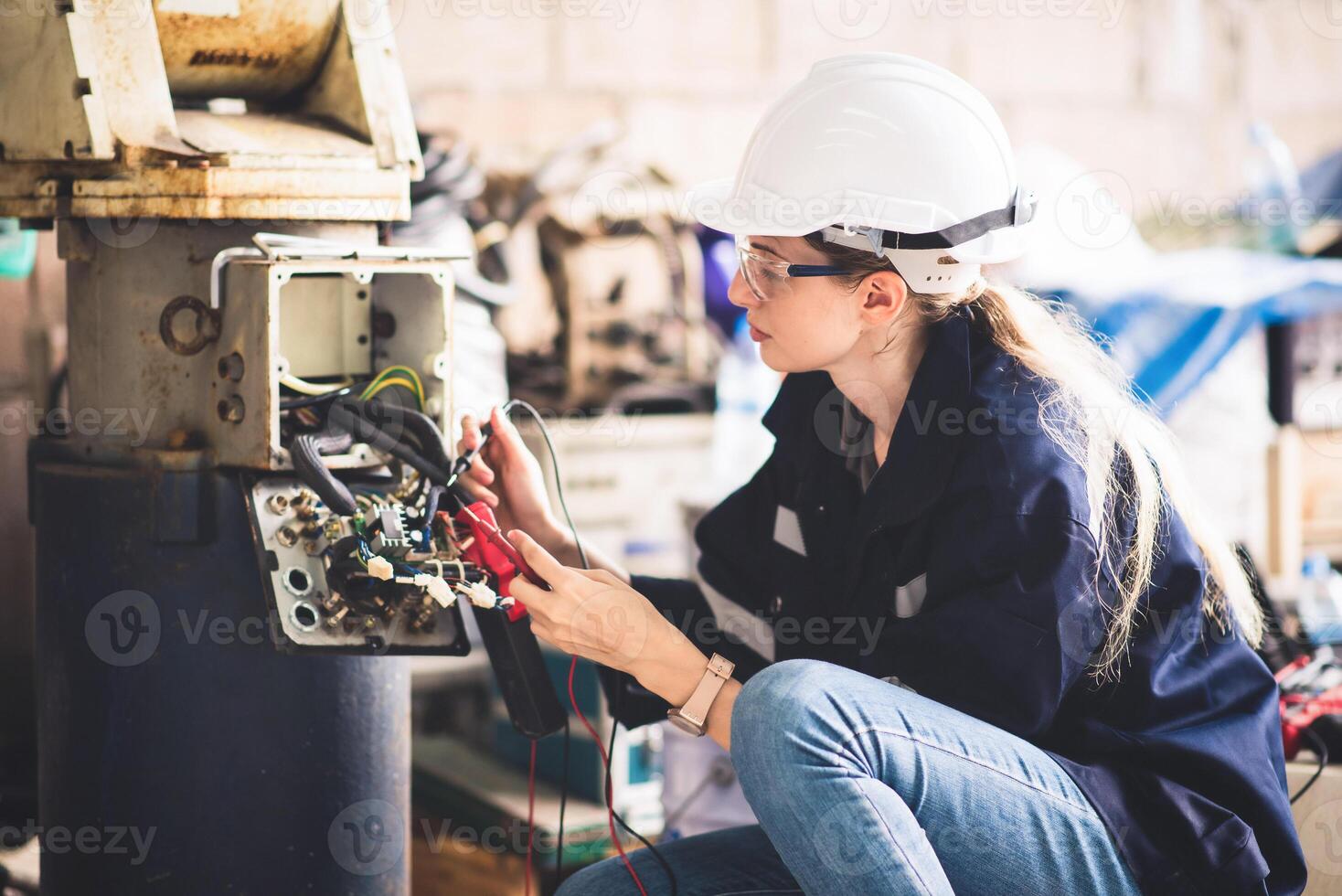 Electrical engineer checking Power Distribution Cabinet in the control room for industrial production. photo