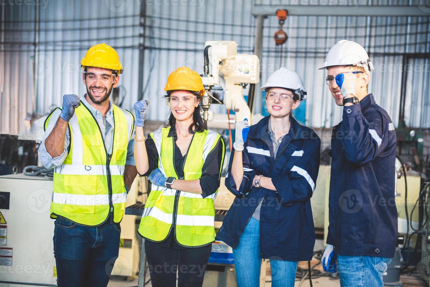 Engineers team mechanic standing in steel factory workshop. Industry robot programming software for automated manufacturing technology photo