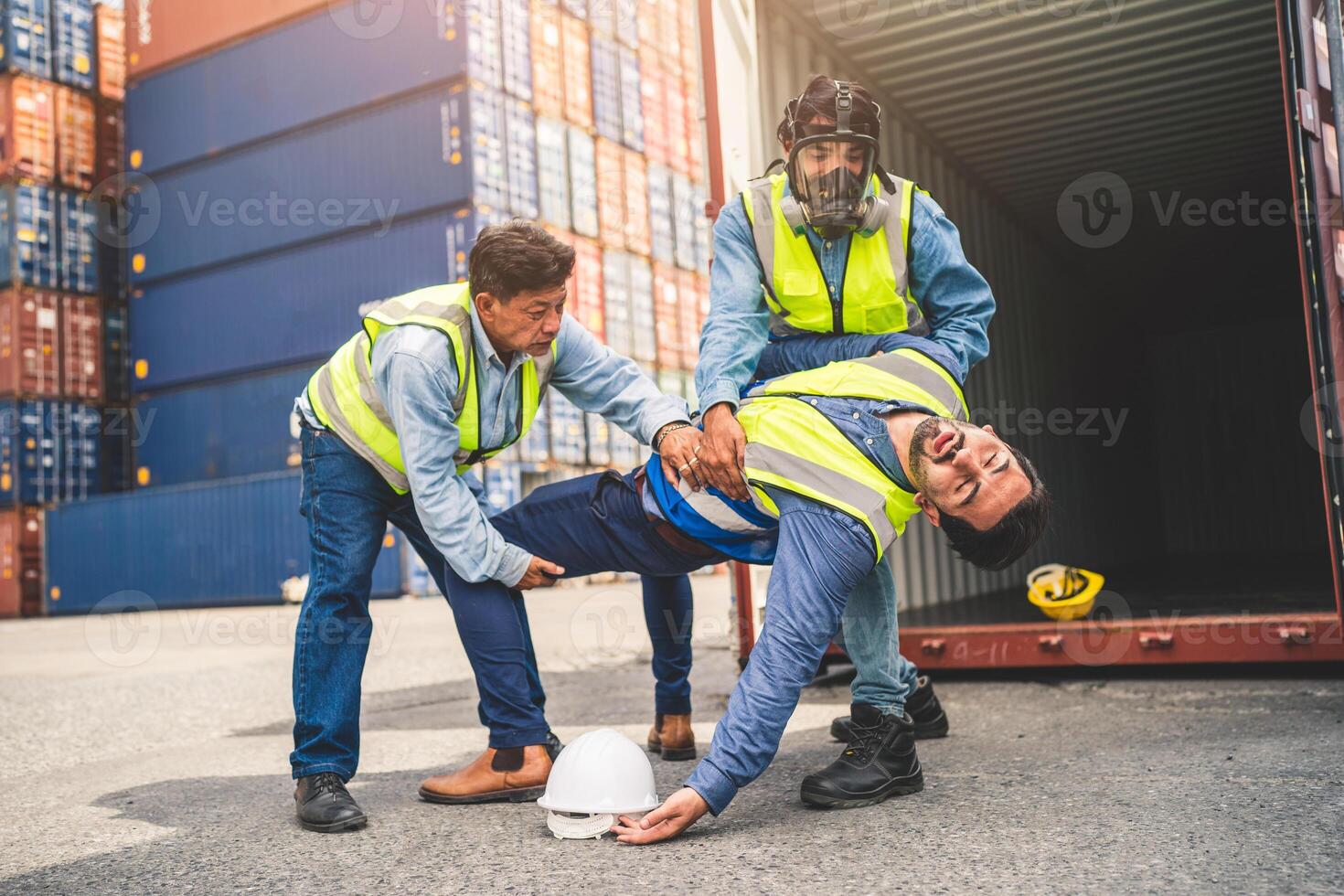 Engineer wear PPE urgently assisted the male technique inside container as Chemical spill in the container shipping industry photo