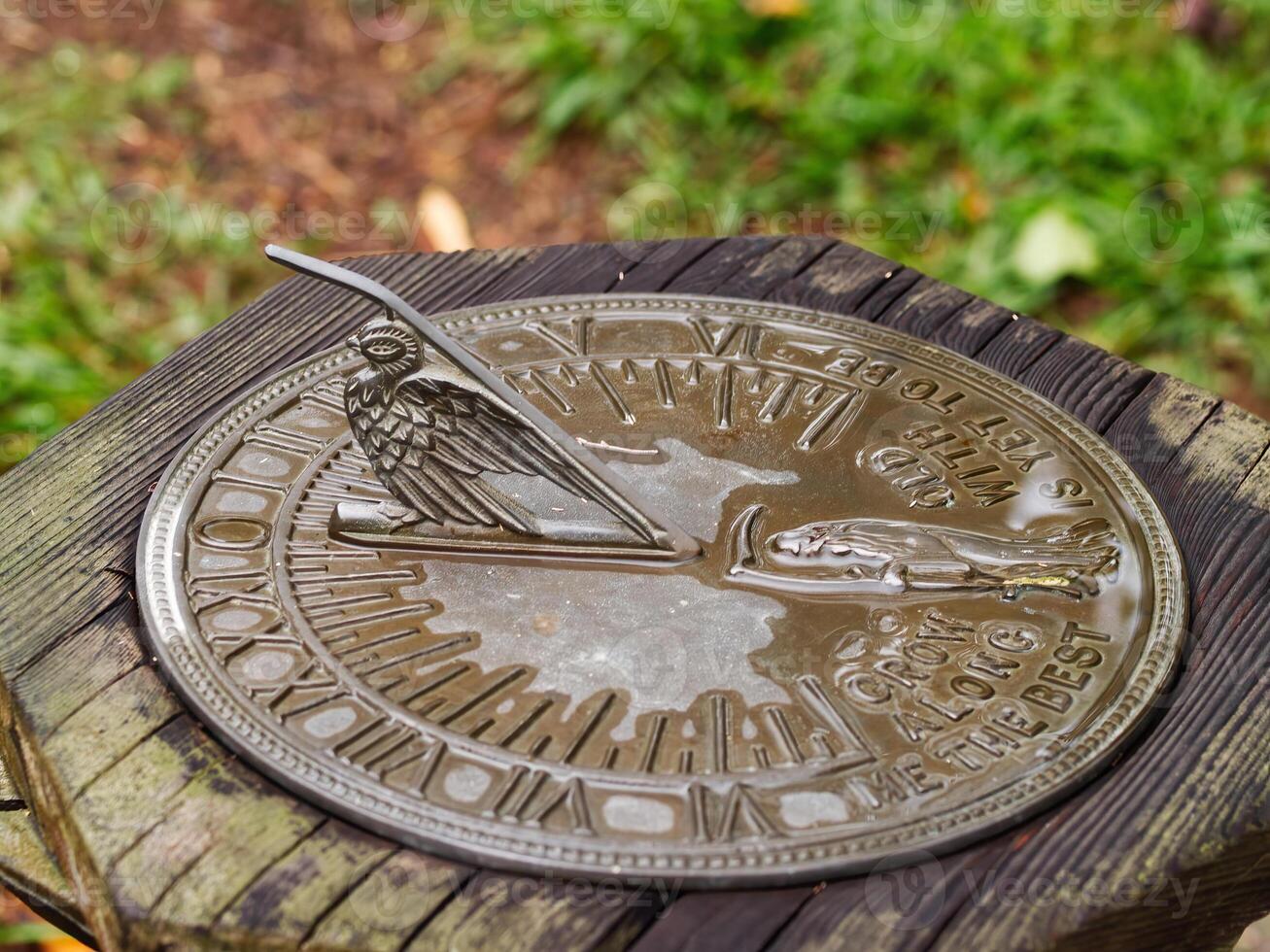 Sundial In Garden On Wet And Overcast Day photo