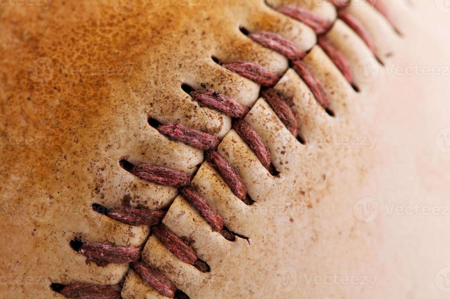 Close-Up Shot Of Threads On Old Baseball photo
