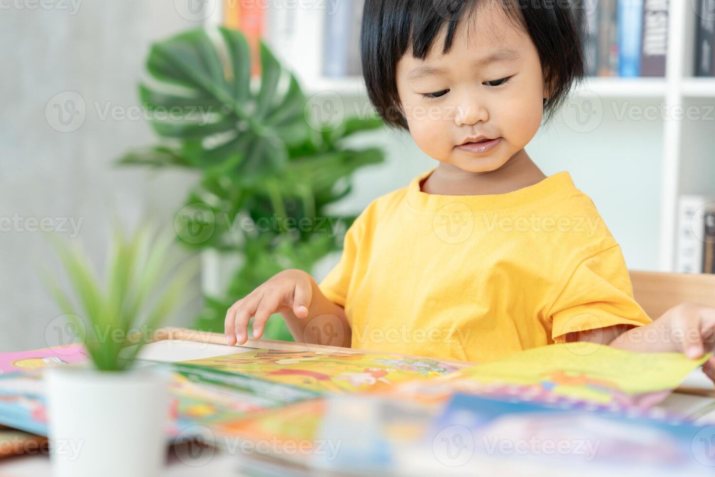 Happy Asian children relax read book at home. daughter and reading a story. learn development, childcare, laughing, education, storytelling, practice, imagine, reduce addiction mobile phone photo