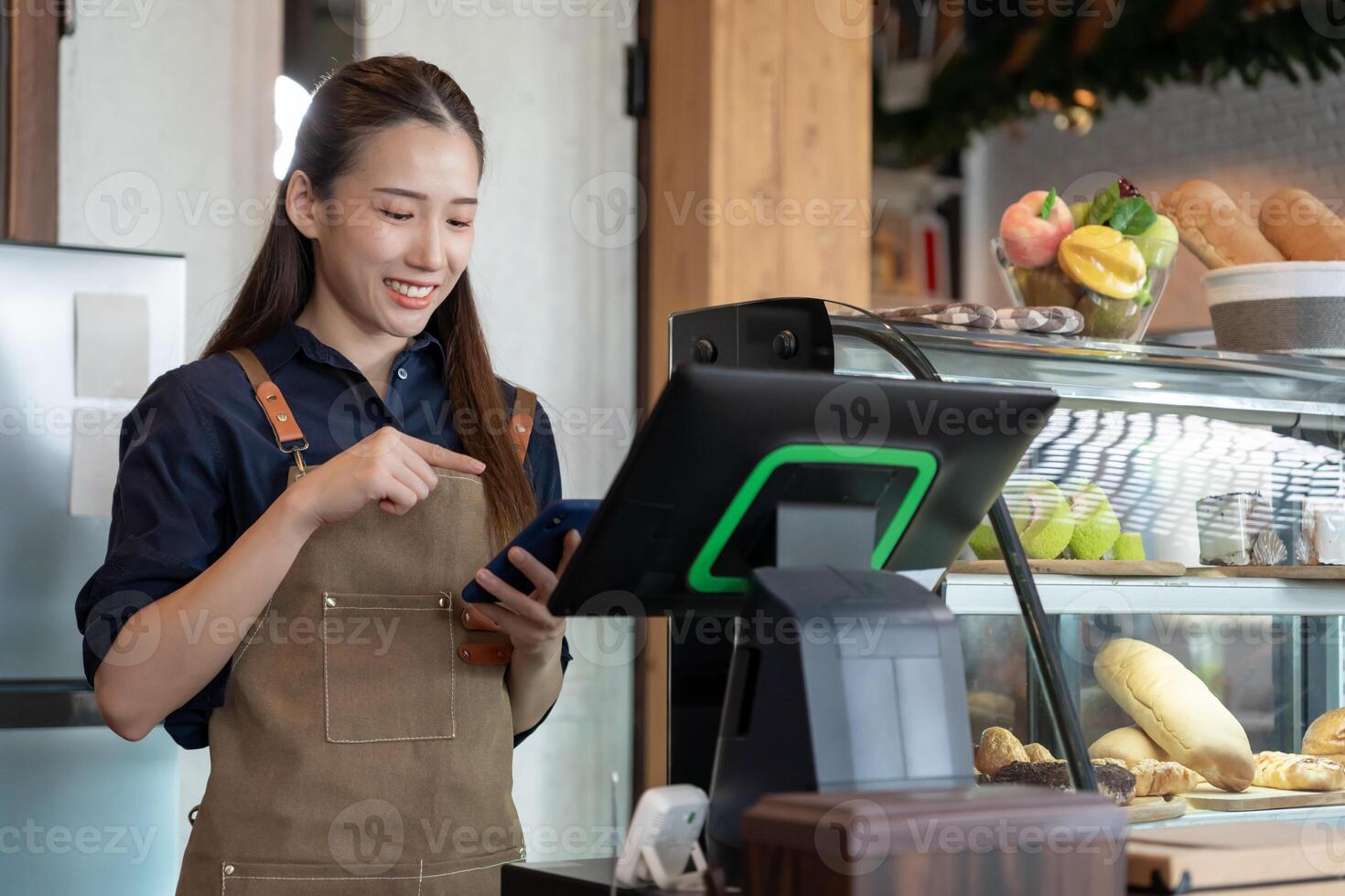 Asia woman owner happy and smile receive order from customer. guarantees safety, cleanliness, open the coffee shop. open for New normal. Small business, welcome, restaurant, home made, cafe photo