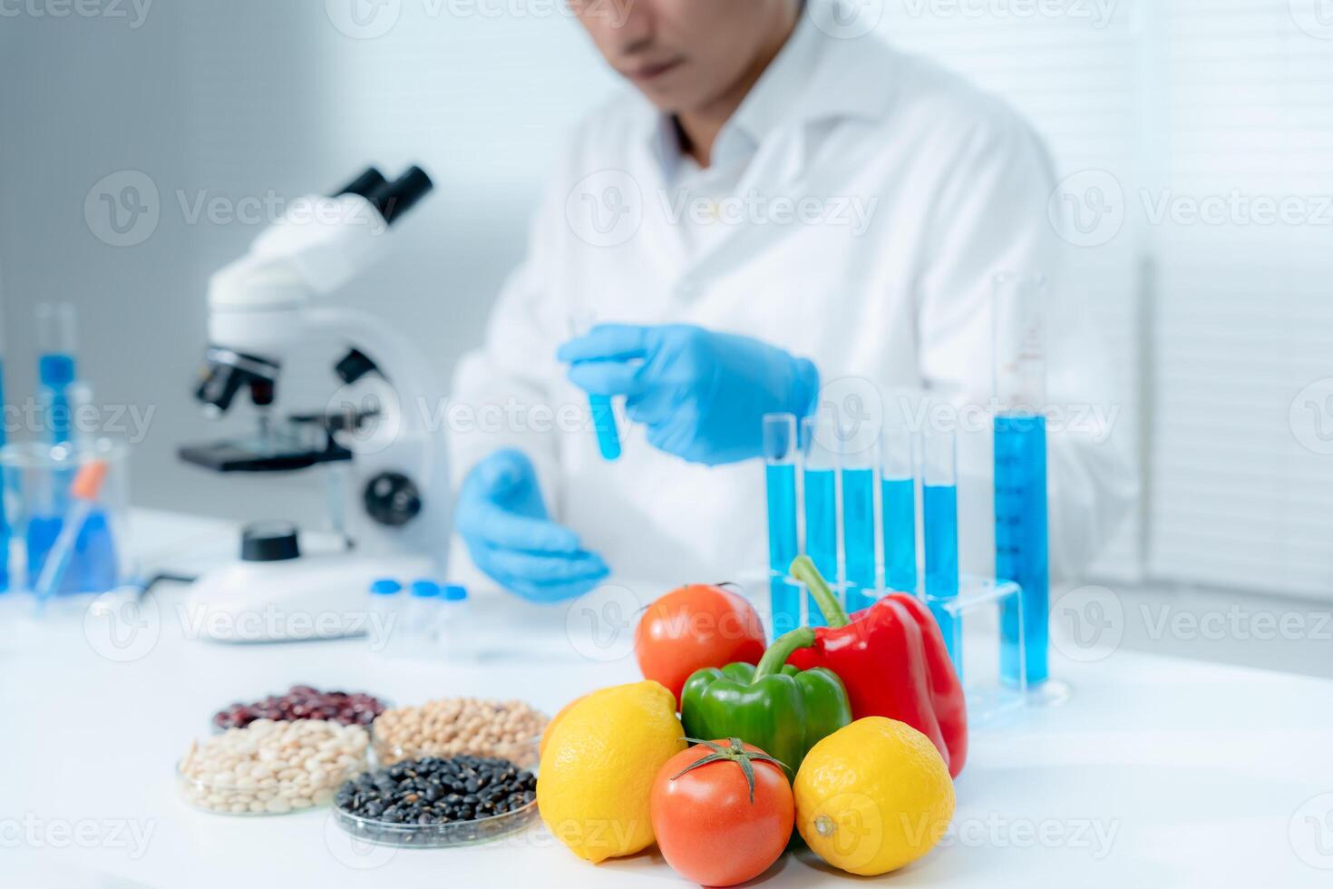 Scientist check chemical food residues in laboratory. Control experts inspect quality of fruits, vegetables. lab, hazards, ROHs, find prohibited substances, contaminate, Microscope, Microbiologist photo