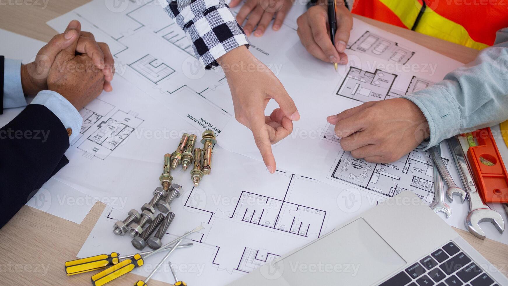 Engineers team and owner discuss check and review the blueprint of construction. Contractor inspection drawing before start project civil. project planning, consulting, architecture. photo