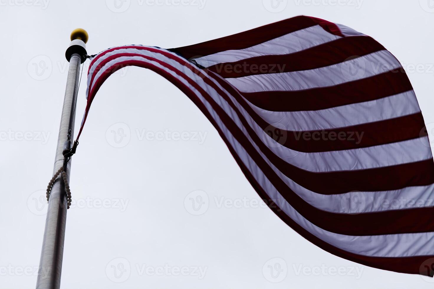 United States Flag Seen From Below On Flagpole photo