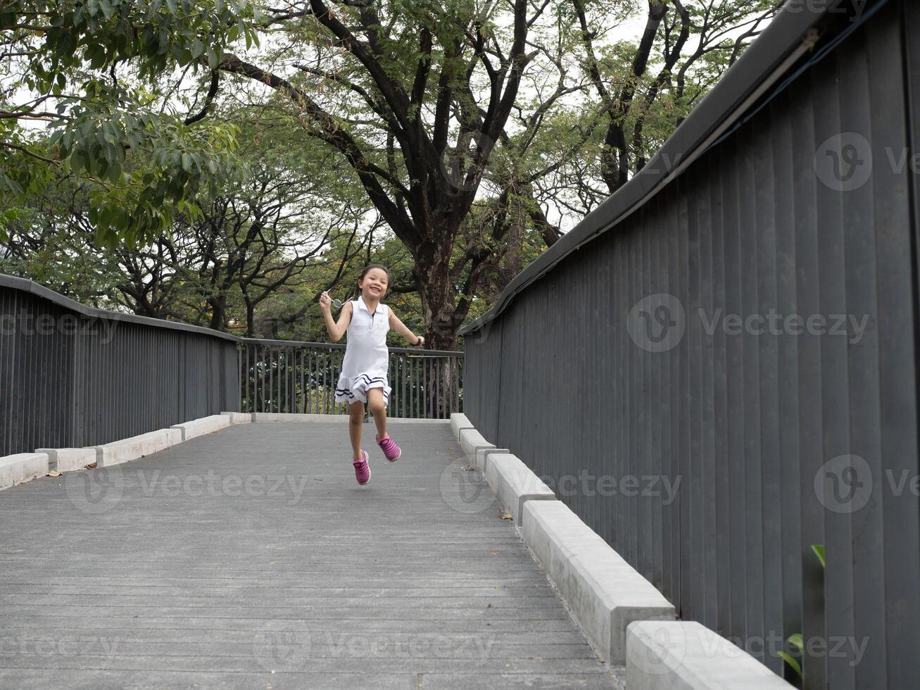 Kid girl child son person people human running walk bridge childhood outdoor lifestyle playing summer sport nature family little park together portrait enjoy fun meadow school freedom happy insurance photo