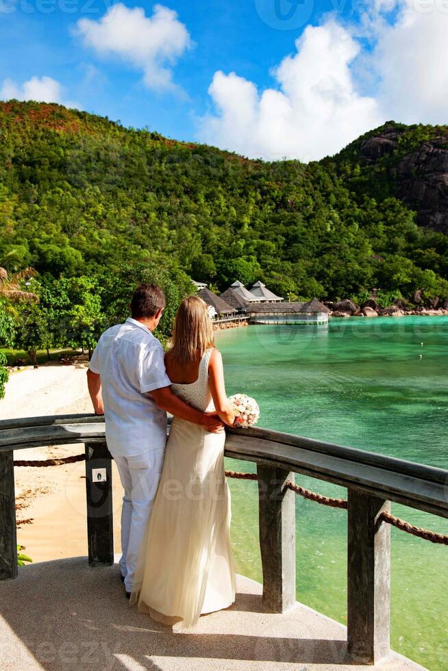 bride and groom on the beach photo