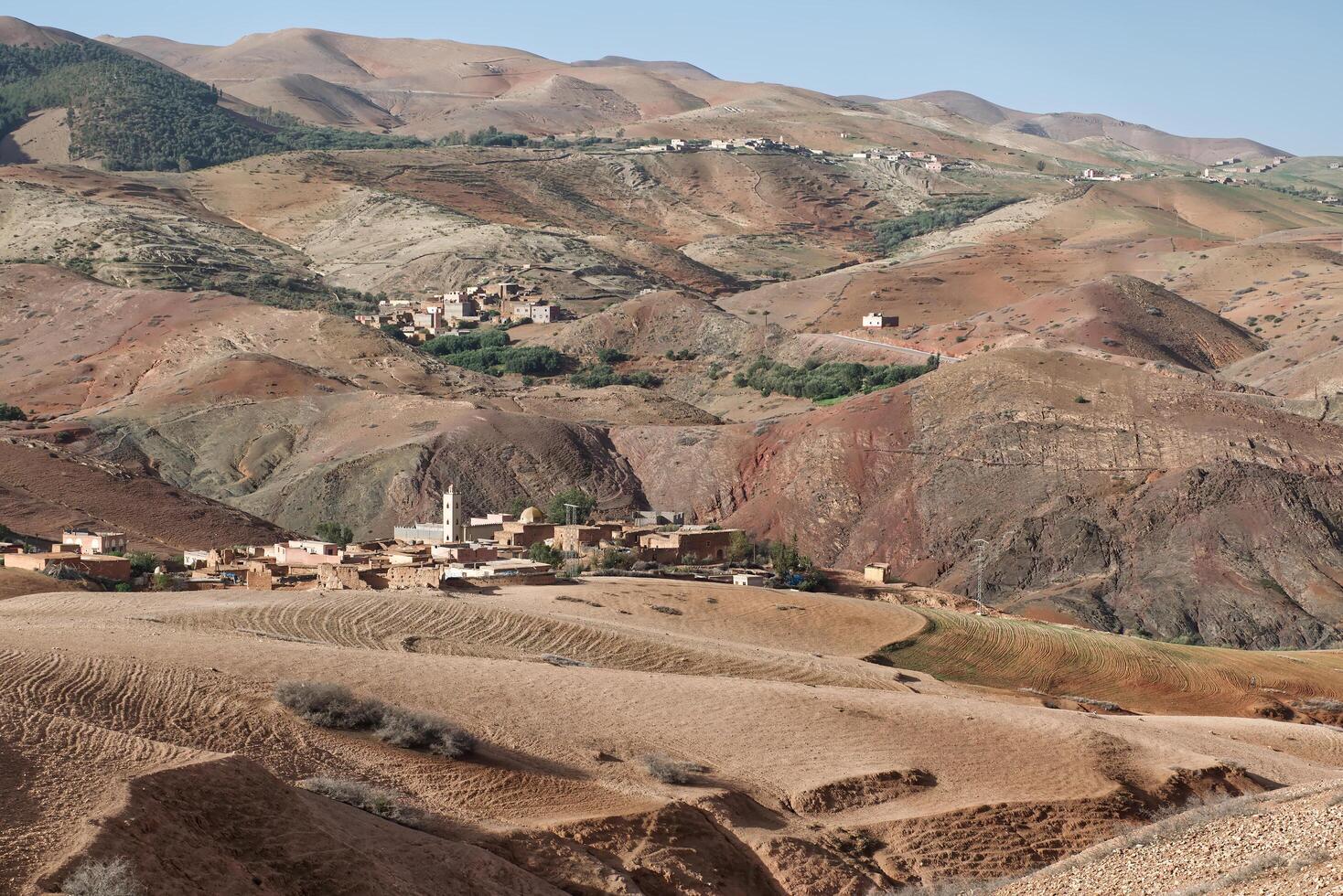 Landscape of desert, mountains and village in Atlas Mountains Morocco near Marrakech. photo