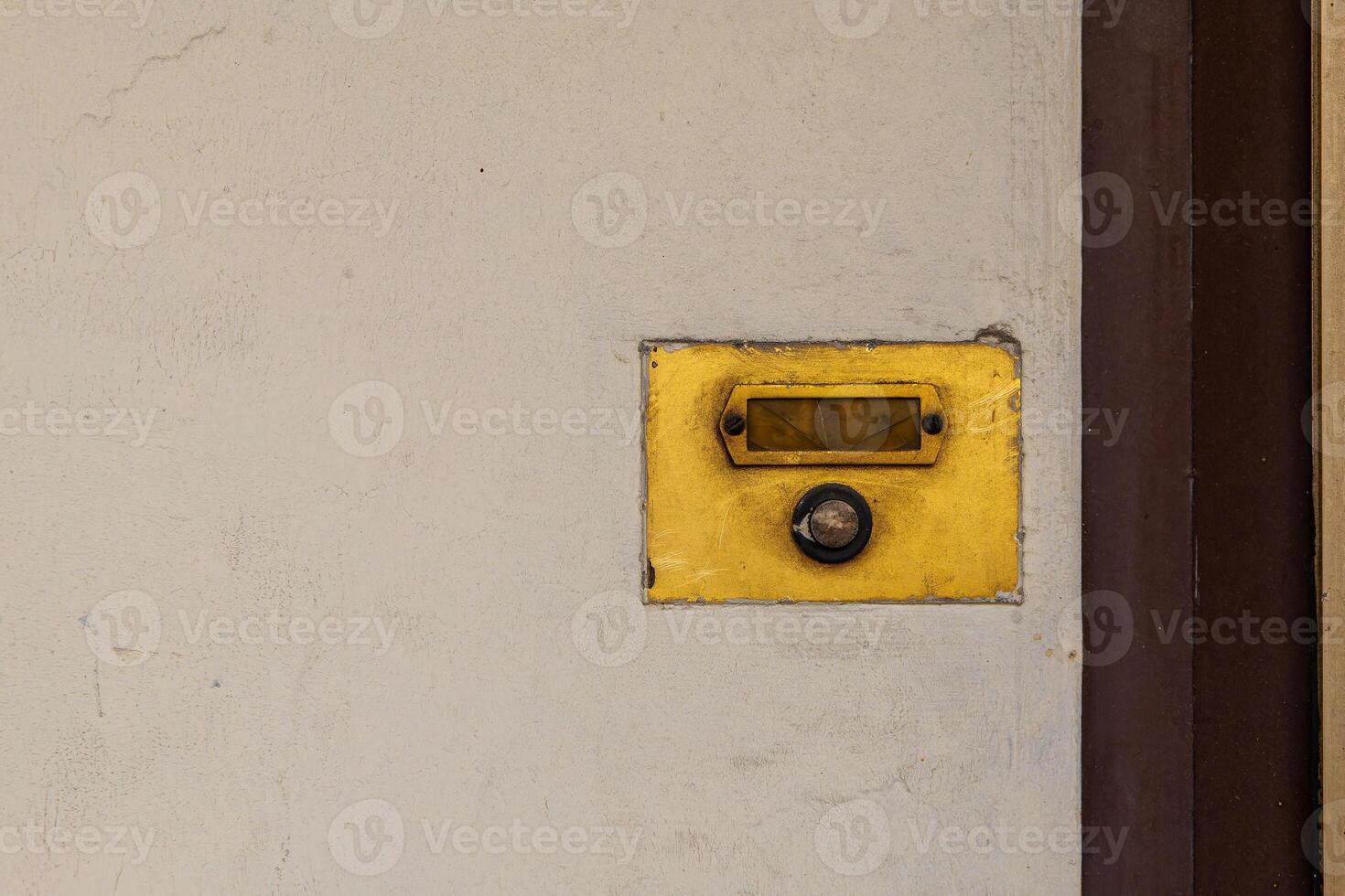 old brown single weathered doorbell photo