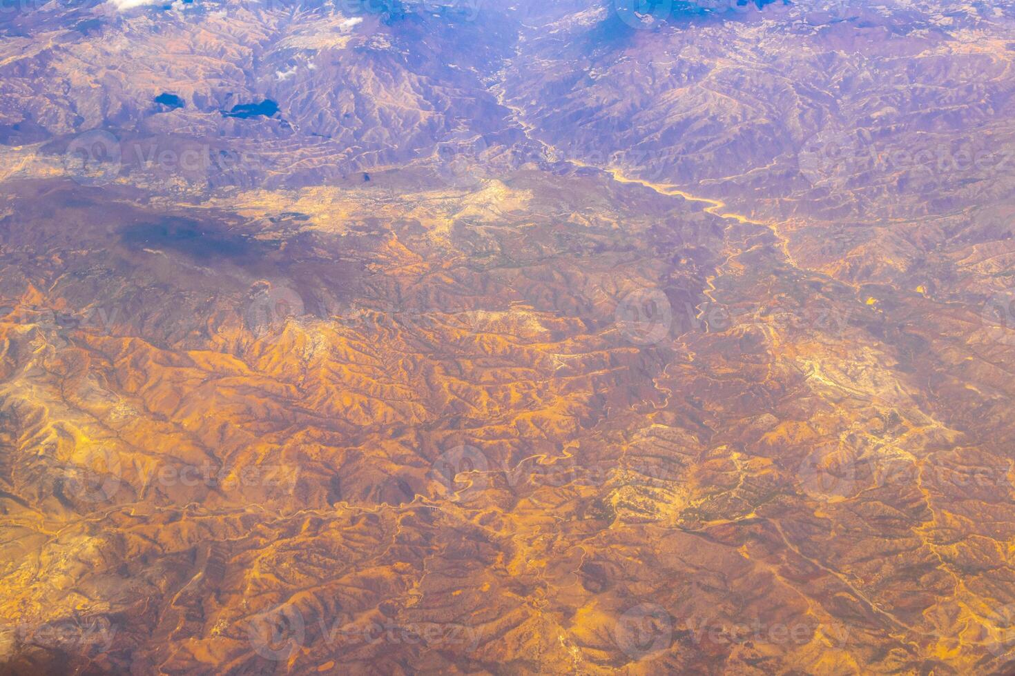 Flying airplane over Mexico Clouds Sky Volcanoes Mountains City desert. photo