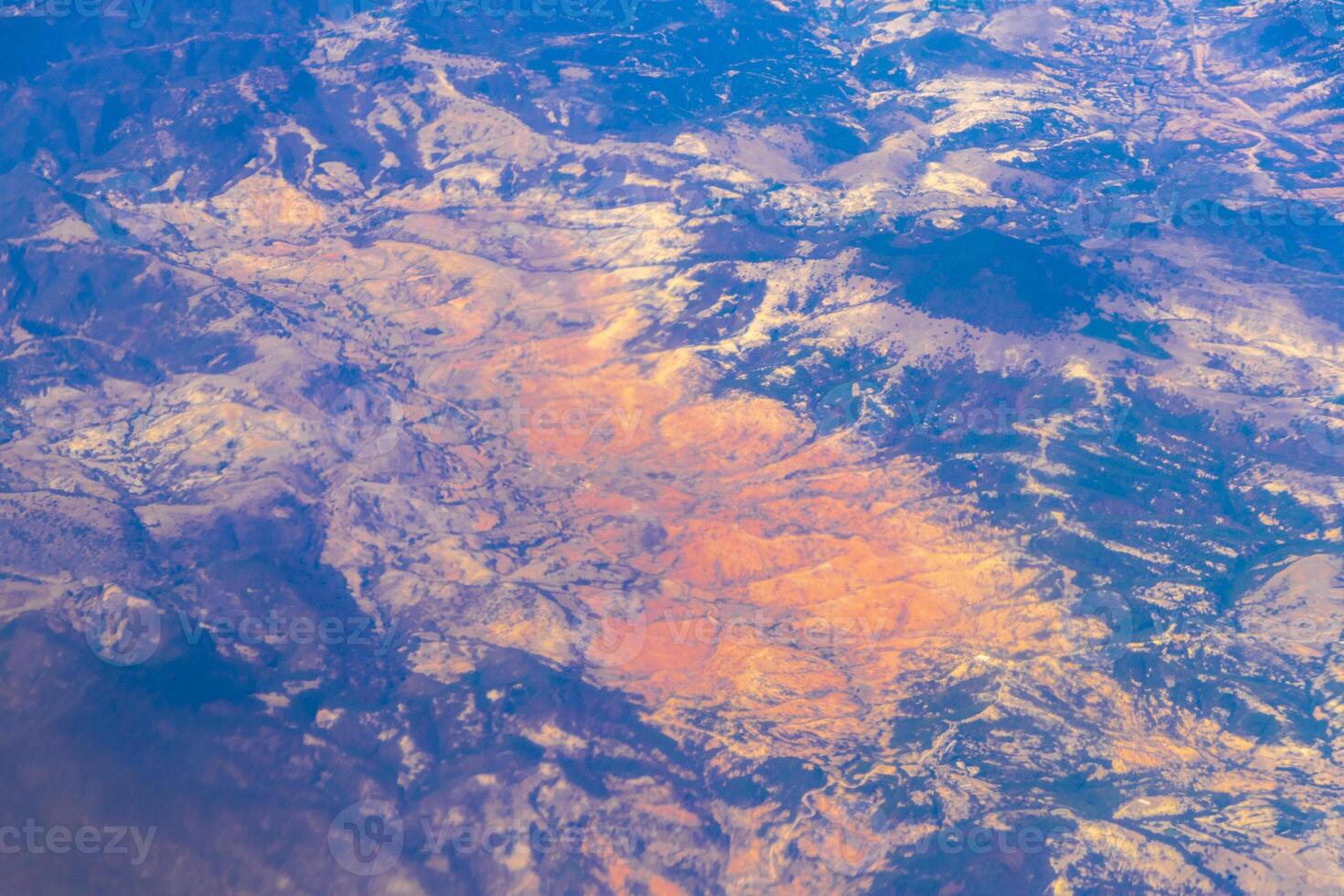 Flying airplane over Mexico Clouds Sky Volcanoes Mountains City desert. photo