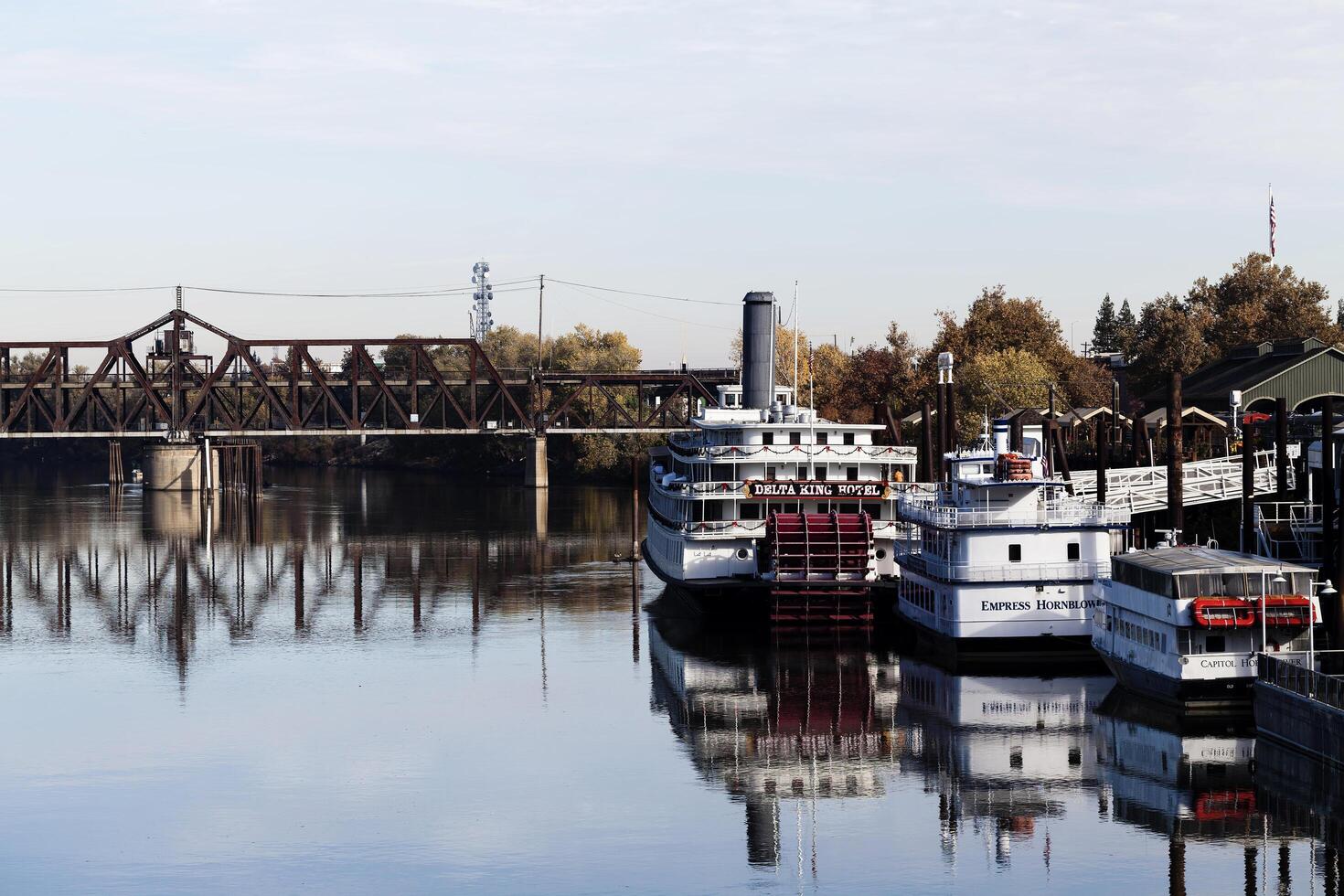 Sacramento, CA, 2012 - Boats On Sacramento River With Reflections In Water photo