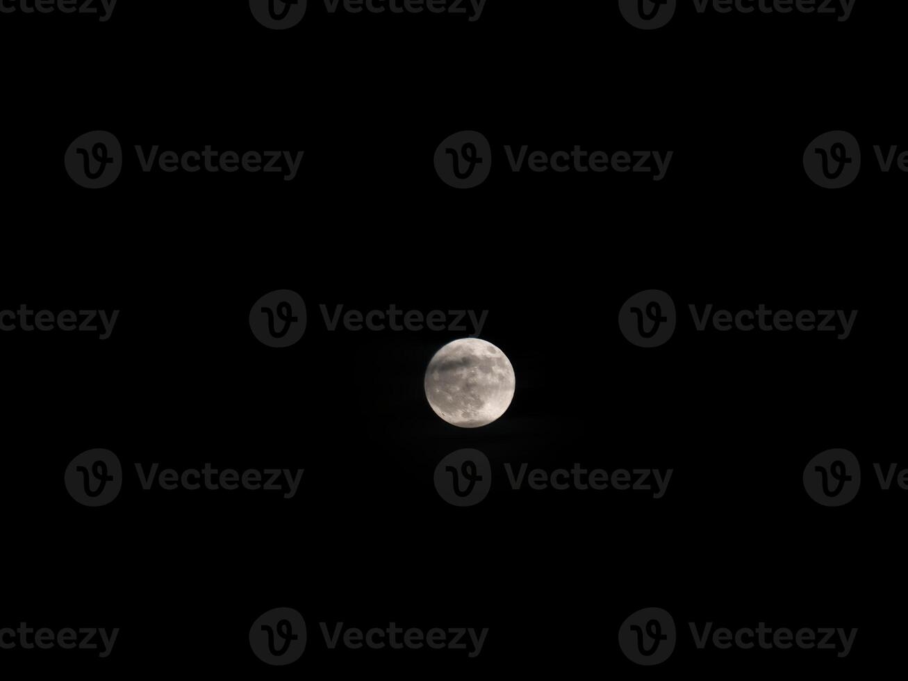 Full Moon In Dark Sky With Wisp Of Cloud In Front photo