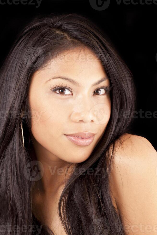 Portrait attractive Pacific Island woman bare shoulders photo