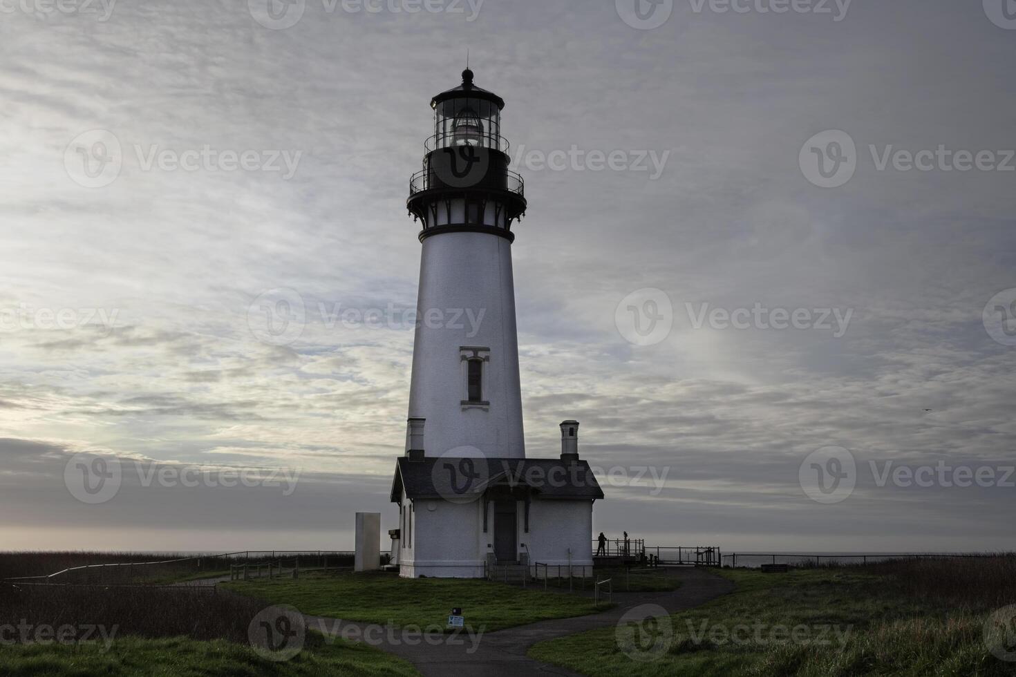 Yaquina Bay Lighthouse Newport Oregon Against Cloudy Sky photo