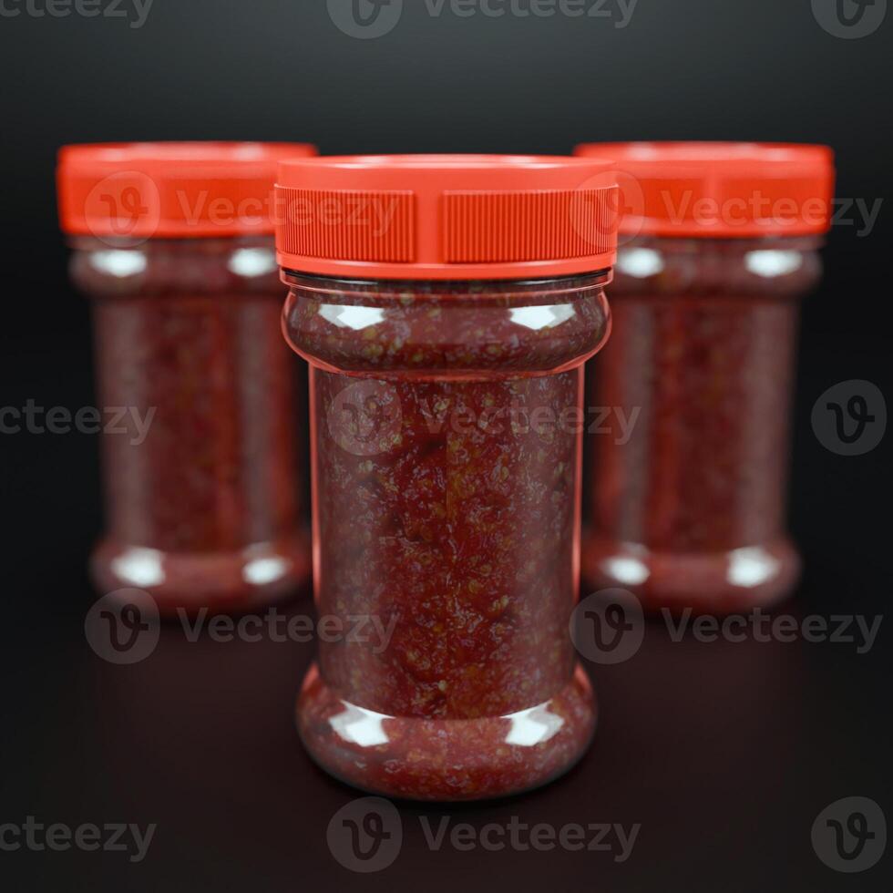 Chilly sauce or ketchup in plastic bottle made of red hot chili peppers. Indonesian chili spice. Mockup for logo or design photo