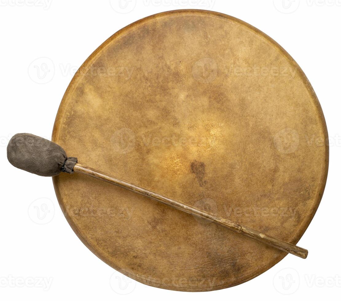 handmade, native American style, shaman frame drum covered by goat skin with a beater isolated on white photo