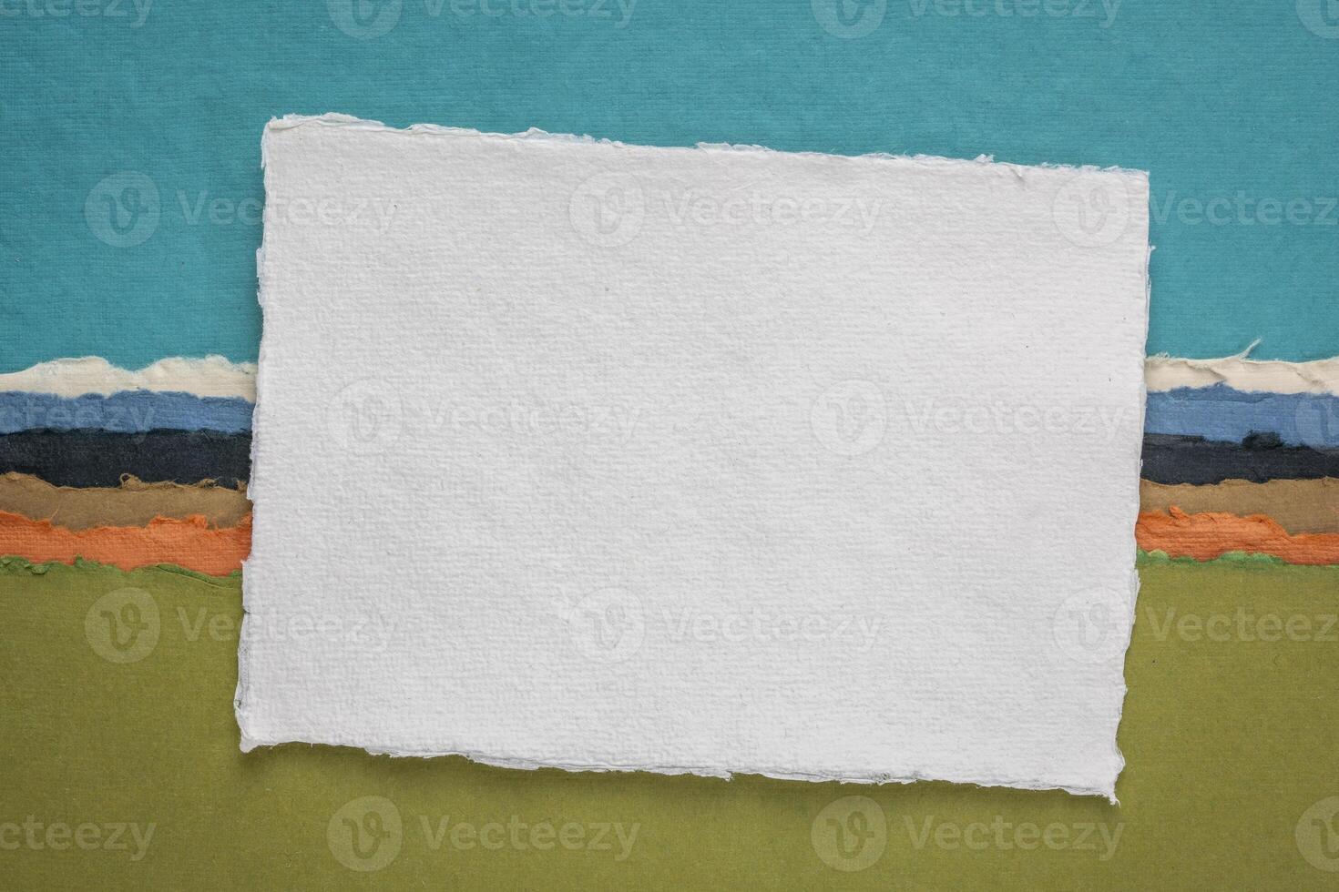 small sheet of blank white Khadi rag paper from India against abstract landscape photo