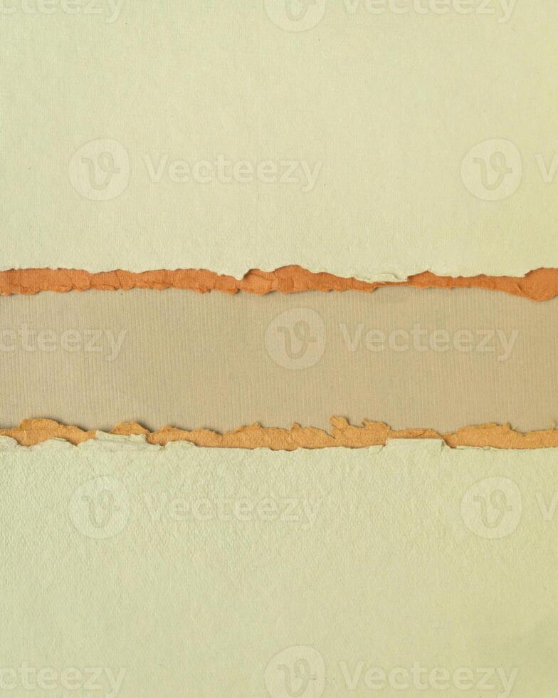 abstract paper landscape in green, orange and brown pastel tones - collection of handmade rag papers, banner in vertical format photo