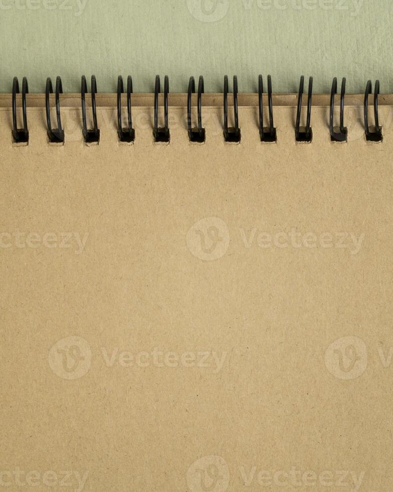 blank spiral notebook on art paper in earth tones photo