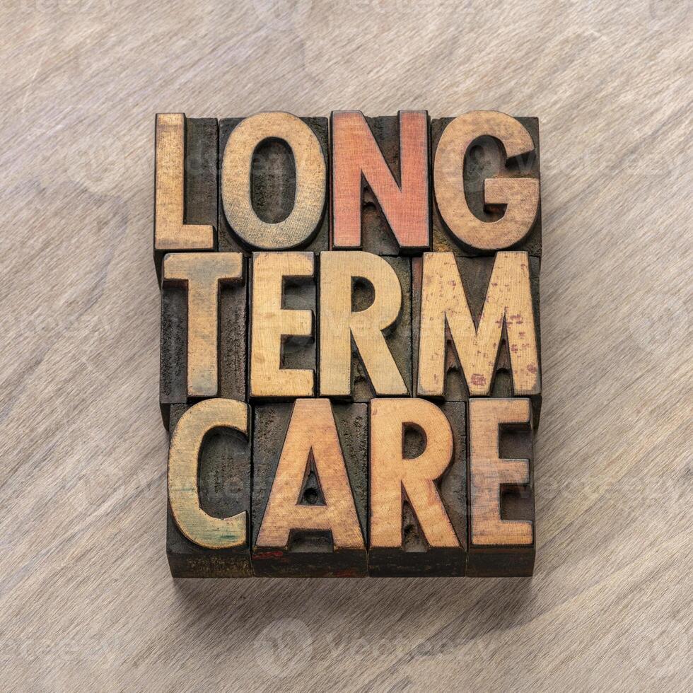 long term care word abstract in vintage letterpress wood type, health and aging concept photo