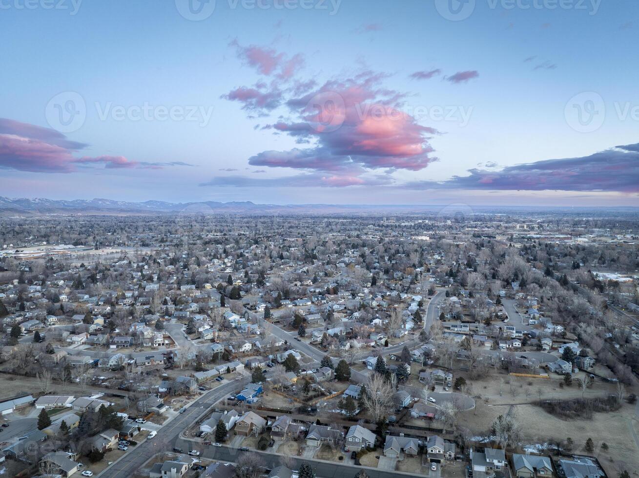 winter dawn over city of Fort Collins and Front Range of Rocky Mountains in northern Colorado photo