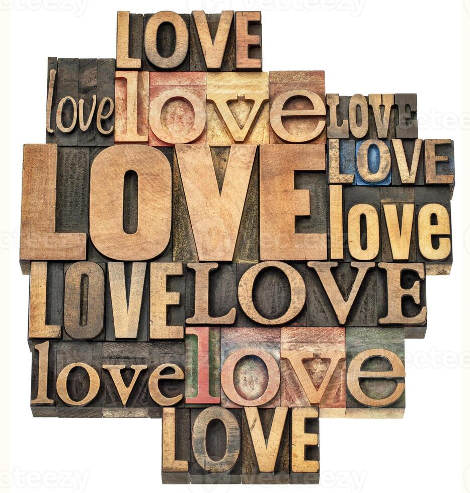 love - isolated word abstract, collage of  text in vintage letterpress wood type printing blocks, Valentine's Day concept photo