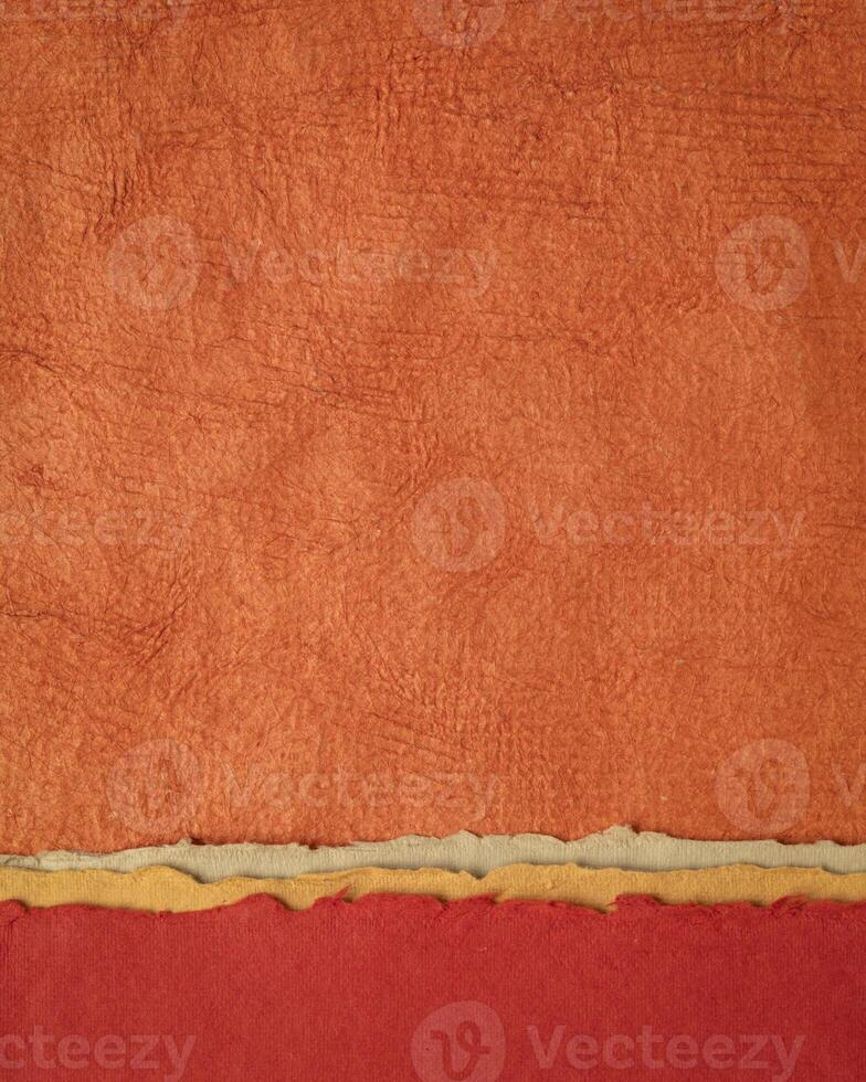 abstract landscape in red and orange - collection of Huun papers handmade in Mexico, vertical background photo